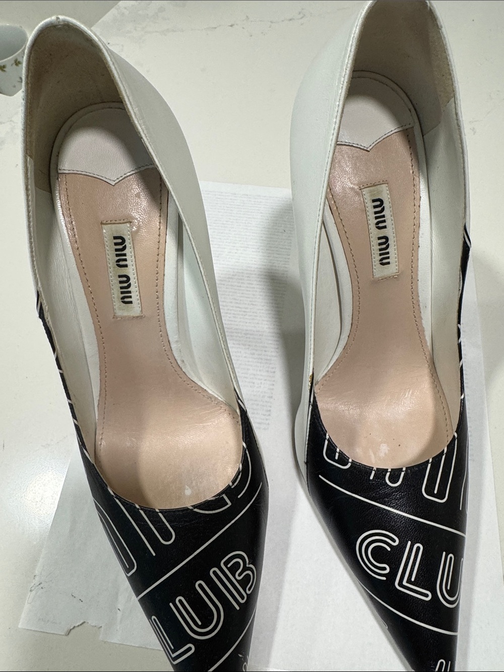 Miu Miu Black and White Logo Pointed Toe Pumps